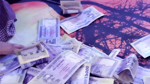 Bangladesh Currency Banknotes. People touching money with hands. man counting Bangladesh money and counting Bangladeshi 1000 taka banknotes.