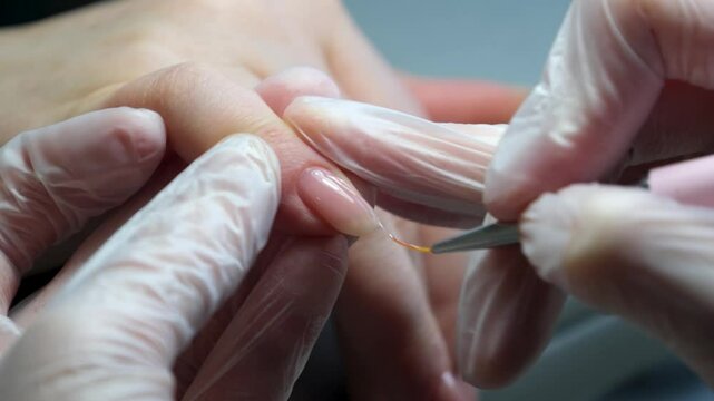 close up view of nail polishing on color back. High quality 4k footage