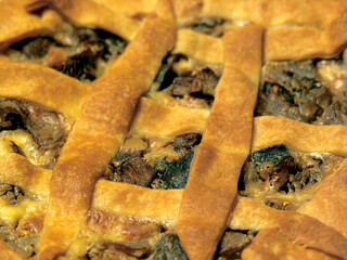 Delicious homemade savory pie with mushrooms and puff pastry crust