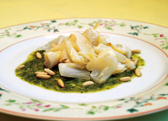 Codfish with Pesto Sauce and Pine Nuts on Elegant Plate