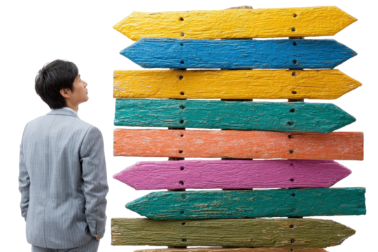 Individual in Suit Contemplating Colorful Directional Signs with Various Shades and Textures Against White Background