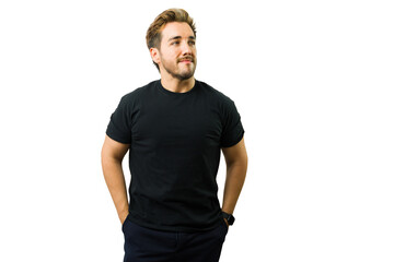 Confident male model posing in studio with hands in pockets