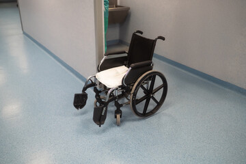 Empty wheelchair in hospital corridor
