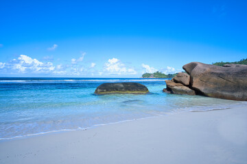 empty and scenic beautiful beach of baie lazare, white sandy beaches with huge stones, Mahe...