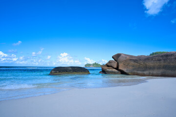 empty and scenic beautiful beach of baie lazare, white sandy beaches with huge stones, Mahe...
