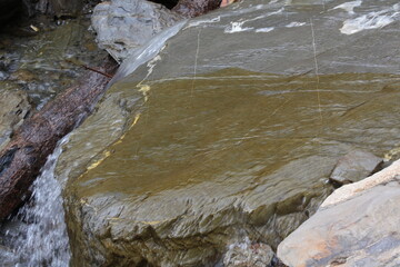 water flowing into the river