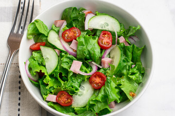 salad top with ham