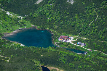 Mountain shelter (Chata pri Zelenom plese) by the pond Zelene Pleso from the Mount Velka Svistovka. Tatra Mountains, Slovakia.