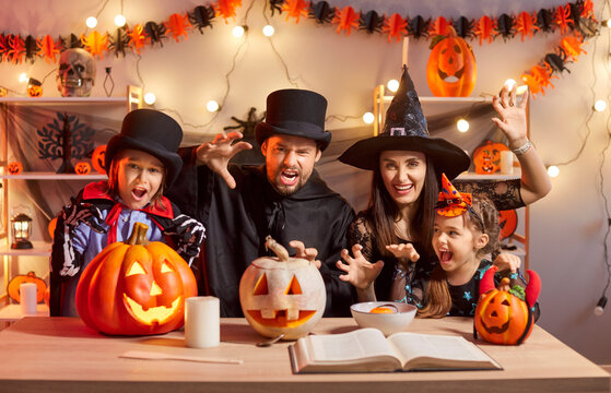 Happy Halloween family party day, pumpkin lantern decor, parents and kids fun gather at home wearing cosplay costumes, people in black, festival amuse, spooky gothic Masquerade ball event, funny joy