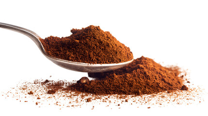 Ground coffee on a spoon spilling onto a pile