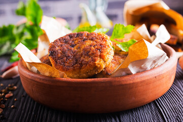 fried cutlets on brown bowl