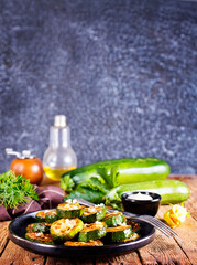 Tasty fried zucchini slices on a plate