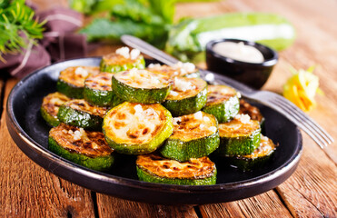 Tasty fried zucchini slices on a plate
