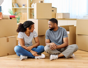 Portrait of a young couple unpacking, moving in and relocation to a new apartment, happy young...