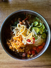 Traditional Kuksi Cold Noodle Soup in Metal Bowl