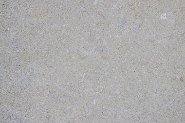 Light gray granular texture imitating asphalt or concrete surface ideal as background for graphic design or photomontage creating minimalist look