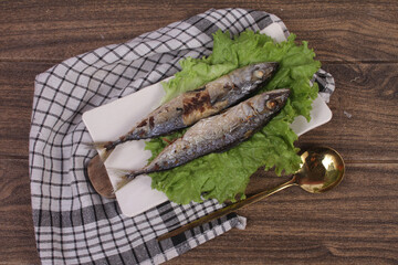 smoked fish on a wooden board