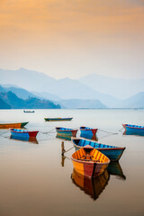 Colourful boats on Pokhara lake side in Nepal.