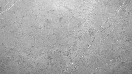 A grey stone wall with a few white lines. The wall is very smooth and has a very clean look