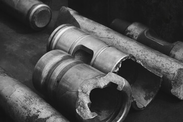 A pile of old, rusted metal pipes and tubes. Scene is one of decay and neglect, dark industrial concept background