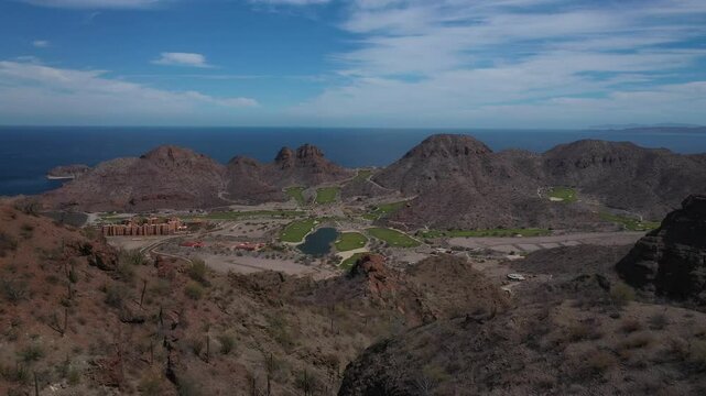 Scenic landscape shows the Loreto Bay Golf Resort and Marina nestled between the mountains and Sea of Cortez