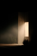 bright window in sleek modern house casts warm light onto empty urban garden at night