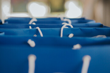 blue goodie bags lined up, selective focus