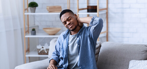 Neck Pain. African American Man Massaging Aching Neck Suffering From Ache Sitting And Working At...