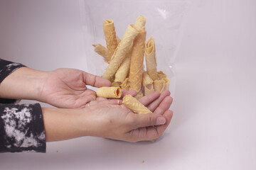 hand holding stick biscuits