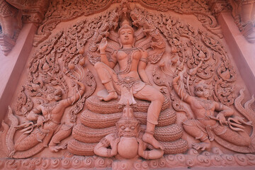 KOH SAMUI, THAILAND - APRIL 5: View of the red Buddhist temple and the palace with sculptures April 5, 2023, Koh Samui, Thailand