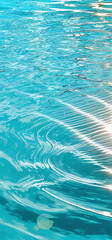 Clear turquoise water surface with sun reflections – tropical sea background