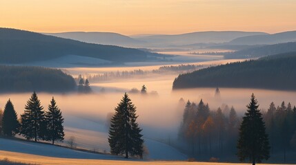 Fototapeta premium Misty mountain valley at dawn