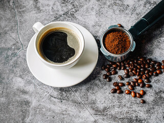 Aromatic Coffee cup and beans with ground coffee on Portafilter, Espresso coffee cup aromatic and making equipment