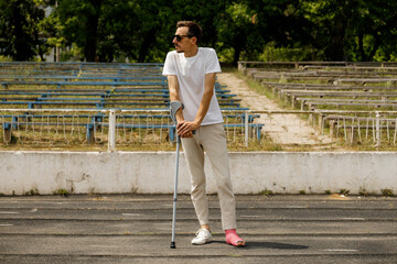 Leg in plaster man with broken leg in plaster injury of young athlete