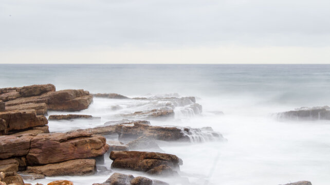 waves crashing on rocks