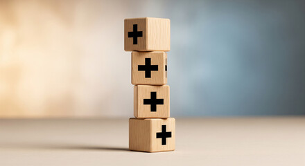 Stack of four wooden cubes with black plus signs, on beige surface against blurred background.  Represents positivity, growth, or addition.  Showcase potential