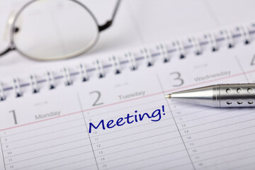 Close-up of a calendar entry highlighting an important business meeting