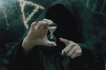 A mysterious figure in a black cloak holds an hourglass against a background of an abstract DNA diagram. Concept of time, fate and inevitability.