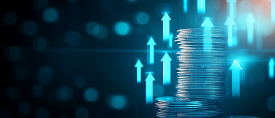 Stacks of coins with blue upward arrows symbolizing financial growth and investment success on a blurred dark background.