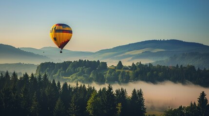 Obraz premium Breathtaking Views: A Hot Air Balloon Soaring Gracefully Over a Lush, Verdant Forest - Capturing the Enchanting Blend of Nature's Beauty and the Thrill of Adventure. Drift through the treetops in a vi