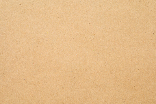 Brown craft paper texture, a versatile background for natural and rustic designs. Ideal for eco-friendly themes and product packaging visuals with its warm, textured surface.
