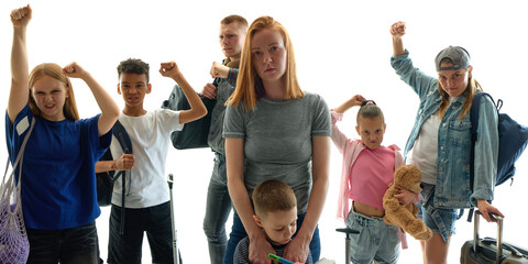 A diverse group raises their fists symbolizing protest and unity during an economic crisis and...