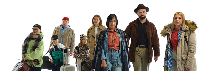 A diverse group of determined people with luggage and coats symbolizes global migration and crisis....