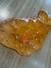 orange slime with colorful flowers