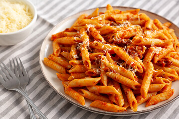 Homemade Pasta Bolognese with Cheese on a Plate, side view.