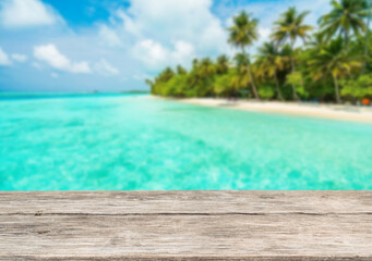 Wooden table top on the beach or sea.Party on the beach  sunshine time concept.For montage product display or design key visual layout.View of copy space.