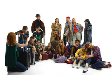 A group of diverse individuals with luggage symbolizes themes of migration and human rights...