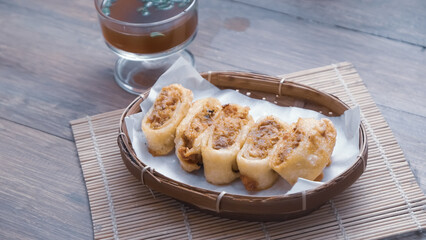 Gohyong is typical chinesse food served with sliced ​​chilies and cuko sauce.