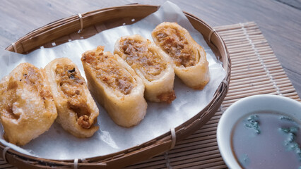 Gohyong is typical chinesse food served with sliced ​​chilies and cuko sauce.
