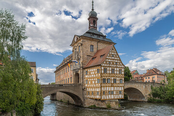 Fototapeta premium The Old Town Hall (Alte Rathaus) in Bamberg, Germany, decorated with frescoes, on island at the Regnitz river.Mentioned in 1387, rebuilt 1461-1467,redesigned in the Baroque and Rococo styles 1744-1756
